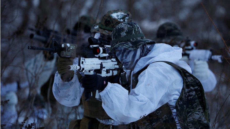 South Korean and US marines in winter camouflage participate in a winter military drill in Pyeongchang, South Korea, 24 January 2017.