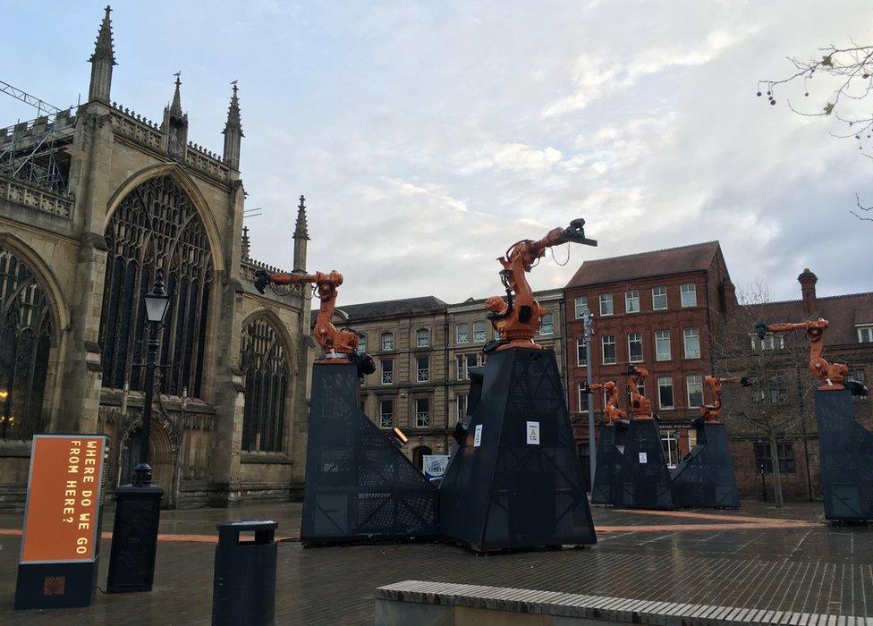 Installation of robotic arms in front of Hull Minster