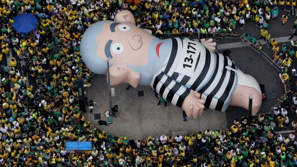 An inflatable doll known as "Pixuleco" of Brazil"s former President Luiz Inacio Lula da Silva is seen during a protest against Rousseff, part of nationwide protests calling for her impeachment, in Sao Paulo