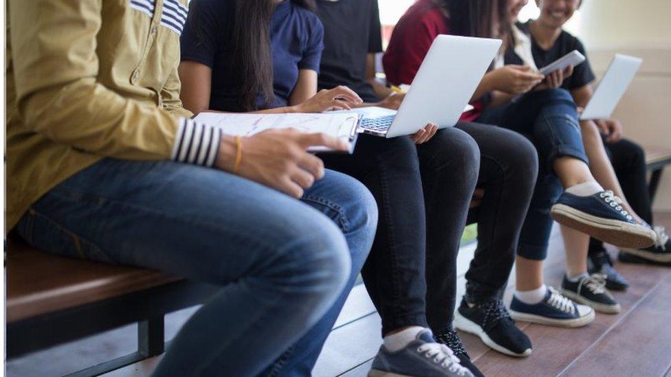 Anonymous students on bench