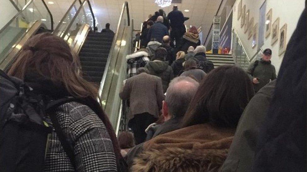 Passenger queues stretching down escalators on Thursday night