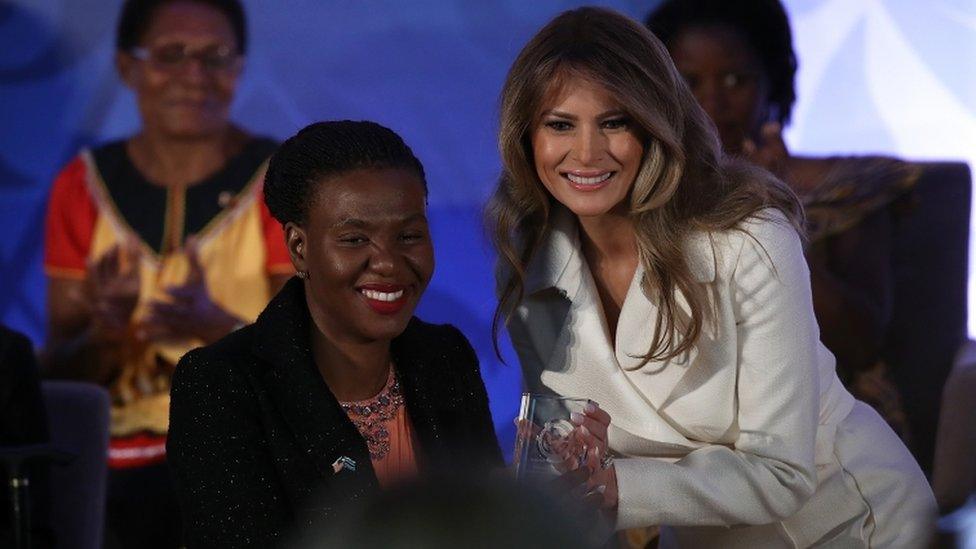 Trump crouched for photos with Botswana's Malebogo Molefhe