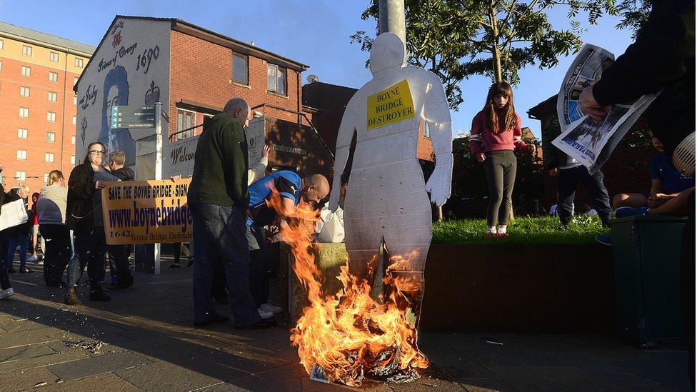 An effigy - representing Translink's plan to replace the bridge - was burned during the protest