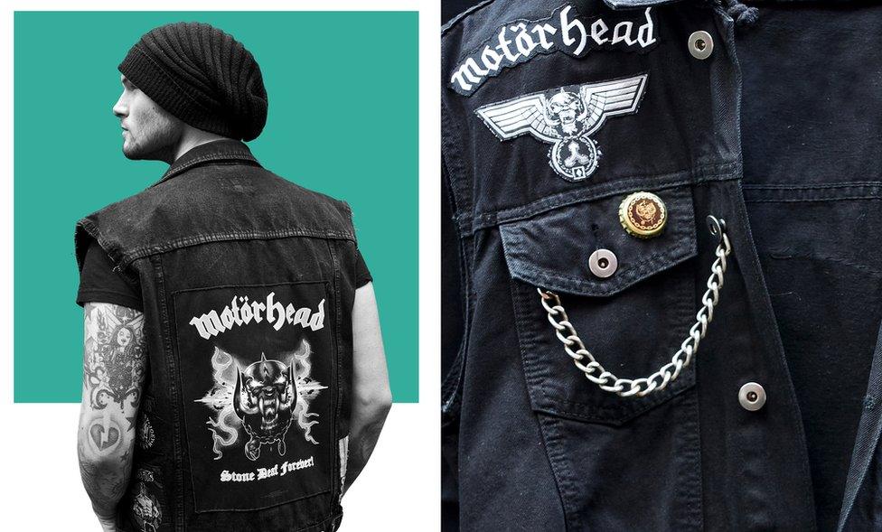 Sam wears a Motorhead jacket.