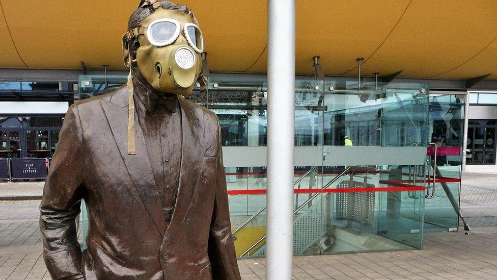 Cary Grant statue with gas mask