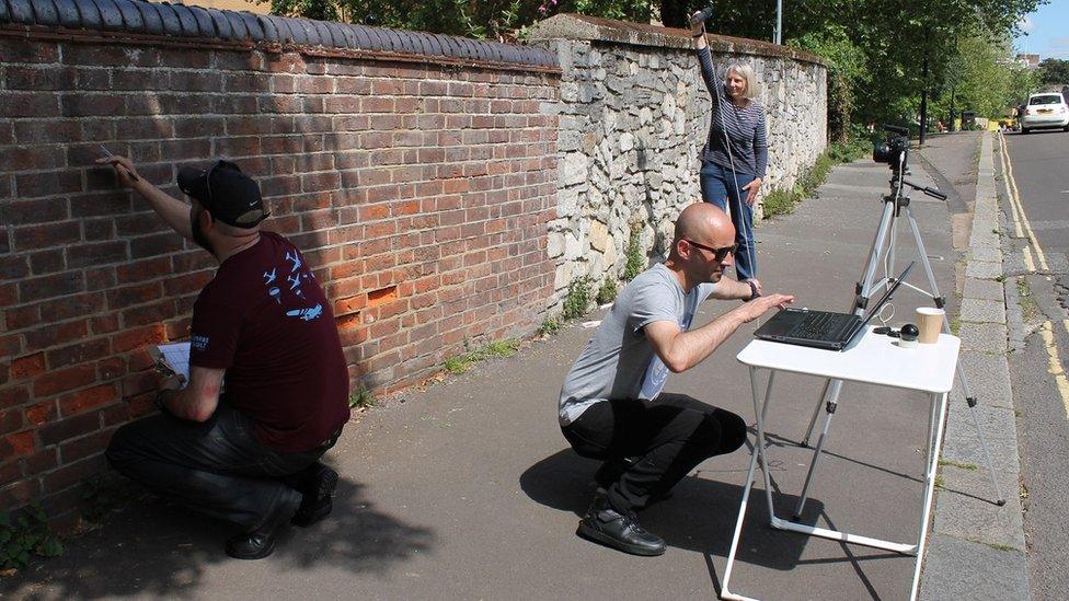 Researchers y the D-Day wall