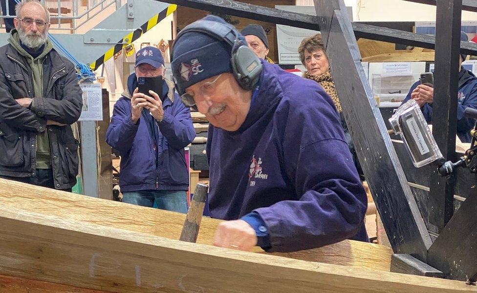 The first nail being added to the hull of the replica Sutton Hoo ship