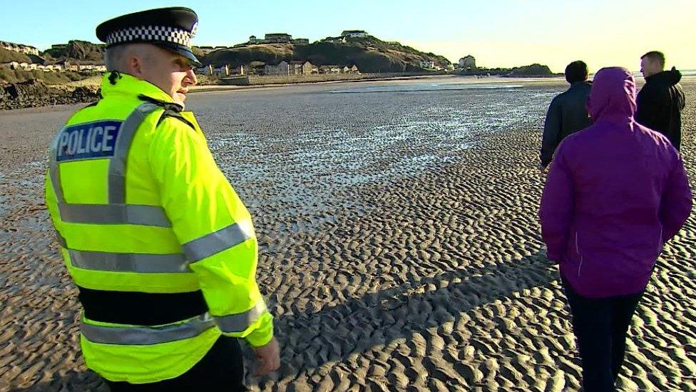 Police officer on beach in Kirkcaldy