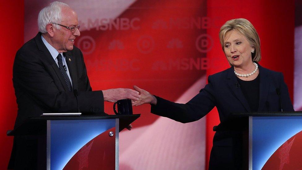 Hillary Clinton and Bernie Sanders mid-debate