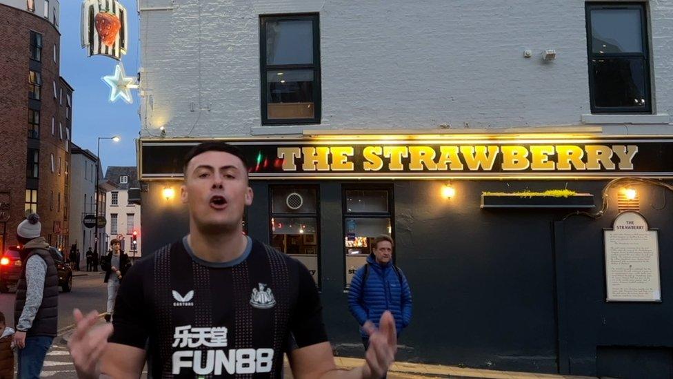 MC Tazo outside The Strawberry pub