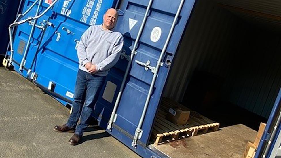 Tony Brotherton in front of container