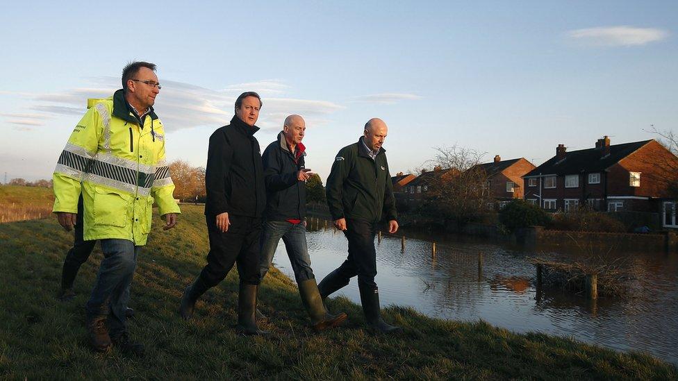 David Cameron and Environment Agency officials in Carlisle