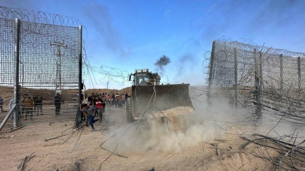 Palestinians breaking into the Israeli side of Israel-Gaza border fence