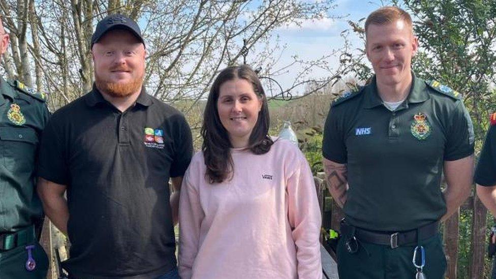 Ashleigh Loach with her husband Dave (left) and a paramedic