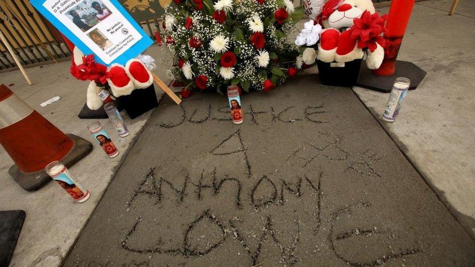 Justice 4 Anthony Lowe scratched onto fresh concrete at a memorial for Anthony Lowe Jr in Huntington Park, California