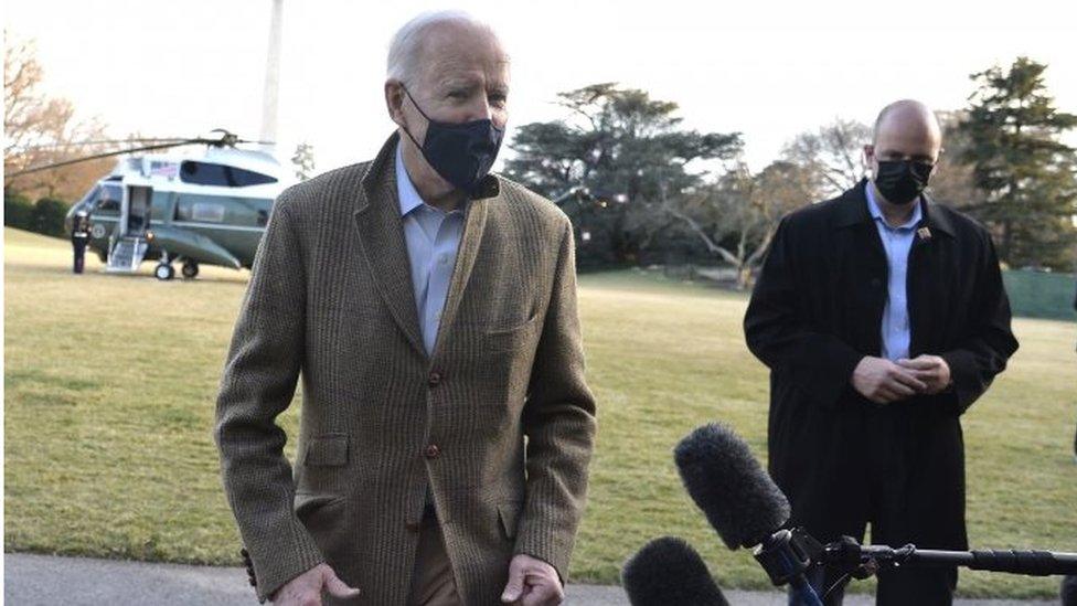 US President Joe Biden (left) speaks to reporters after returning to the White House in Washington DC. Photo: 14 March 2021