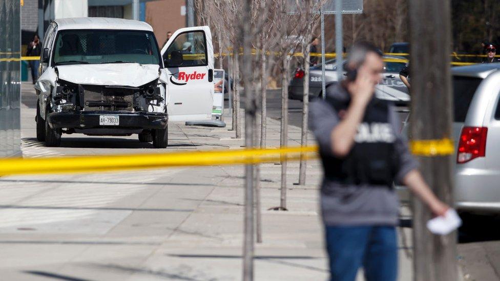 Police inspect a van suspected of being involved in a collision injuring at least eight people at Yonge St. and Finch Ave. on April 23, 2018 in Toronto, Canada.