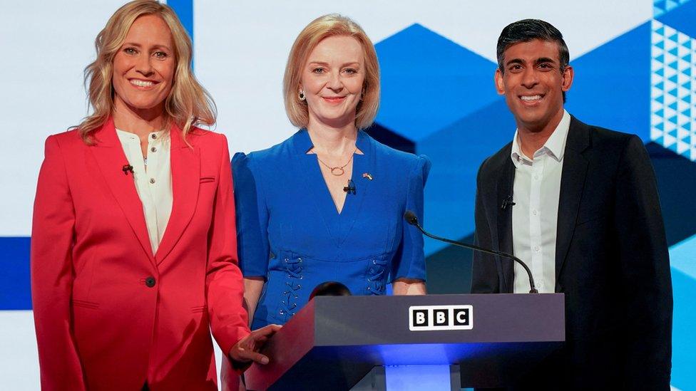 Moderator Sophie Raworth and candidates Liz Truss and Rishi Sunak on stage at start of the BBC leadership debate