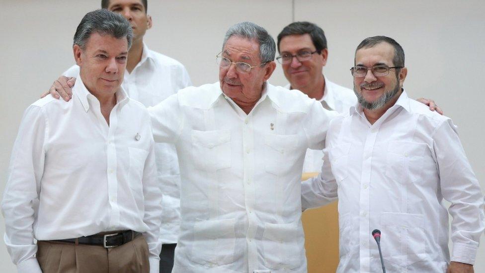 Cuba"s President Raul Castro, (C), Colombia"s President Juan Manuel Santos, (L), and FARC rebel leader Rodrigo Londono, better known by the nom de guerre Timochenko, pose for photos in Havana, September 23, 2015.