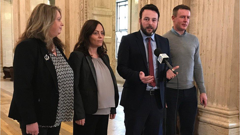 SDLP leader Colum Eastwood (second right) speaking to the media at Stormont