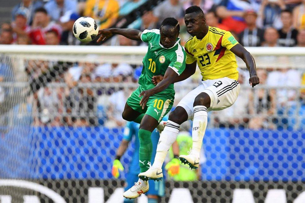 Senegal's forward Sadio Mane (L) heads the ball as he vies for it with Colombia's defender Davinson Sanchez (R) during the Russia 2018 World Cup Group H football match between Senegal and Colombia at the Samara Arena in Samara on June 28, 2018.