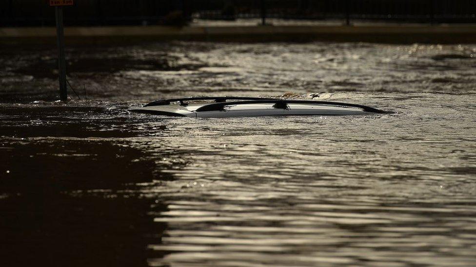 Roof-of-car-just-visible-under-floodwater.