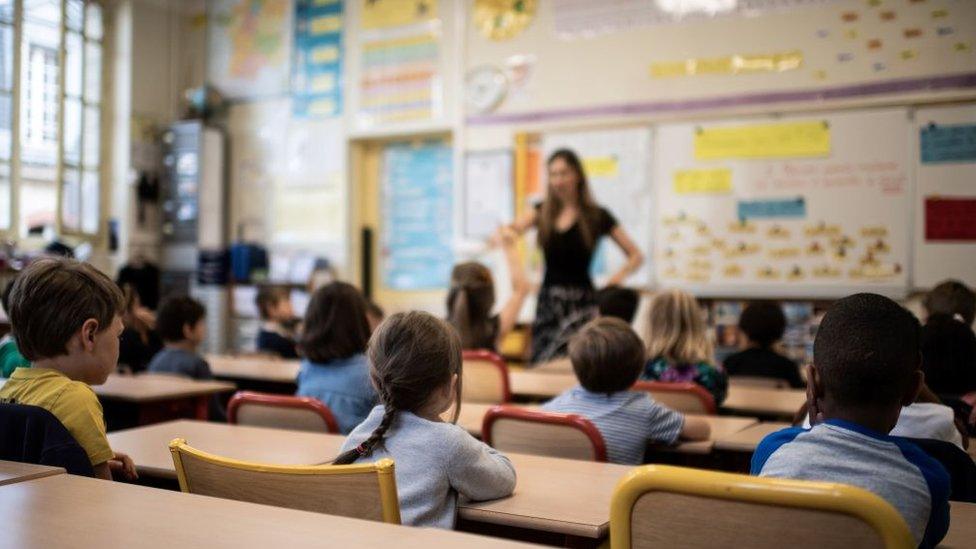 Teacher in class room