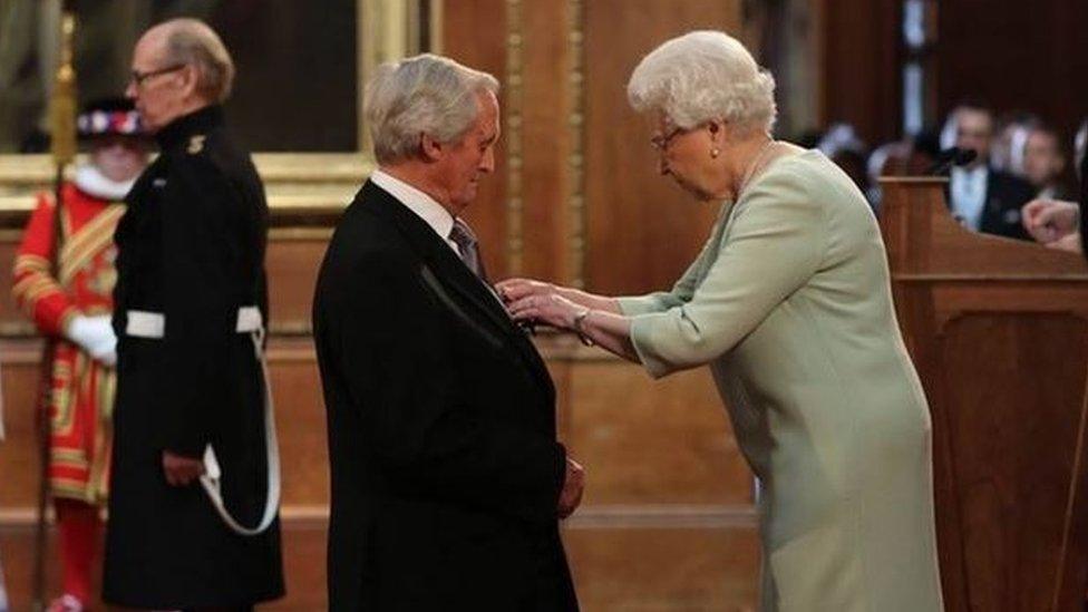 Bob Woodward being awarded the OBE by the Queen