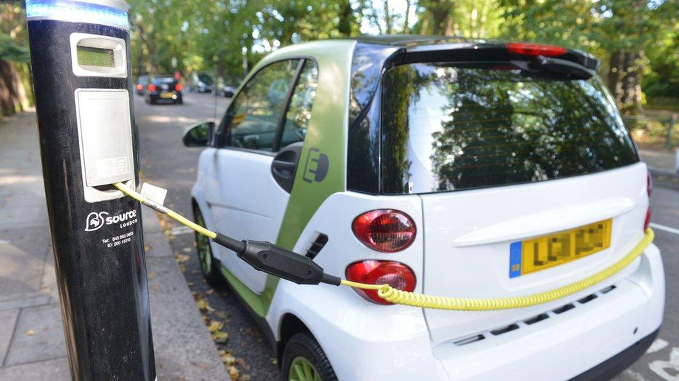 A small electric car charging in London