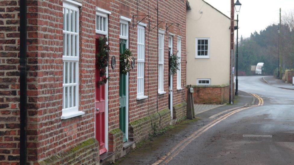 Christmas wreaths on doors in Fishlake