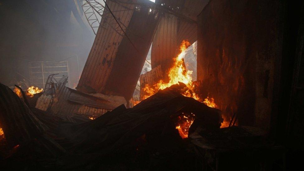 A view of a stand on fire at the Oriental Market in Managua, Nicaragua, 14 May 2017