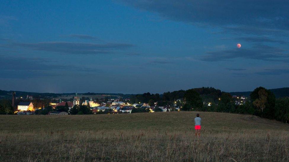 Michal admiring the moon in Šluknov, a town in the north of the Czech Republic