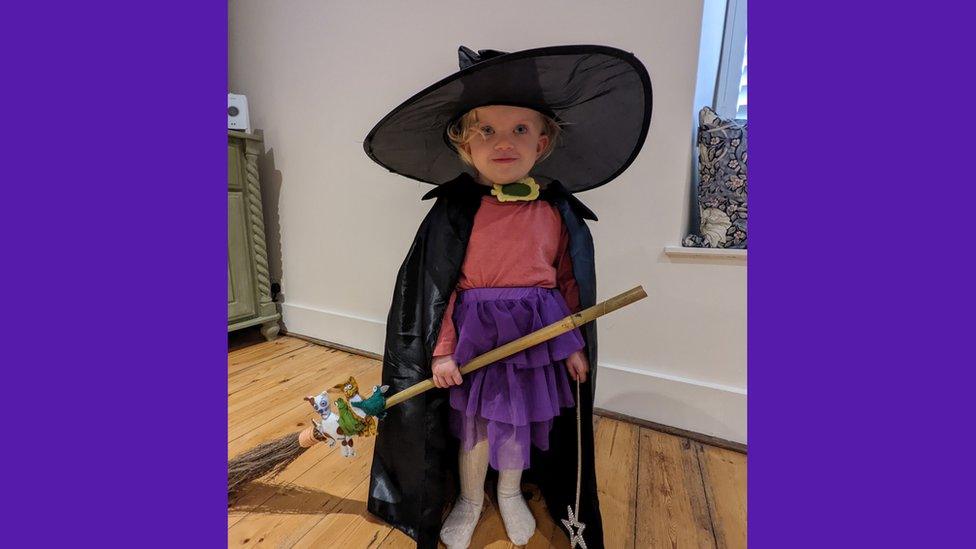 Girl dressed as witch.