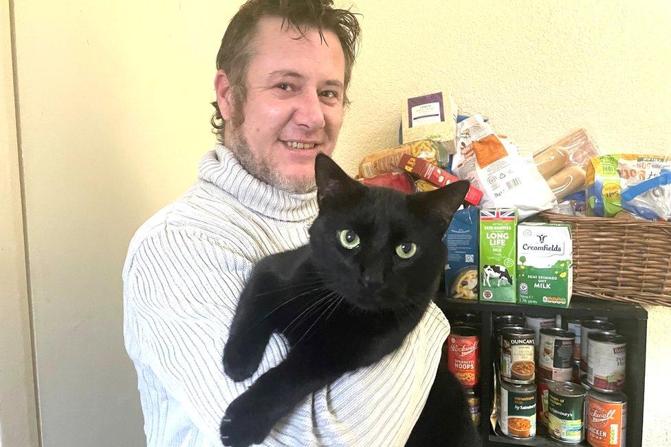 Chris Forrest with his cat, Leo