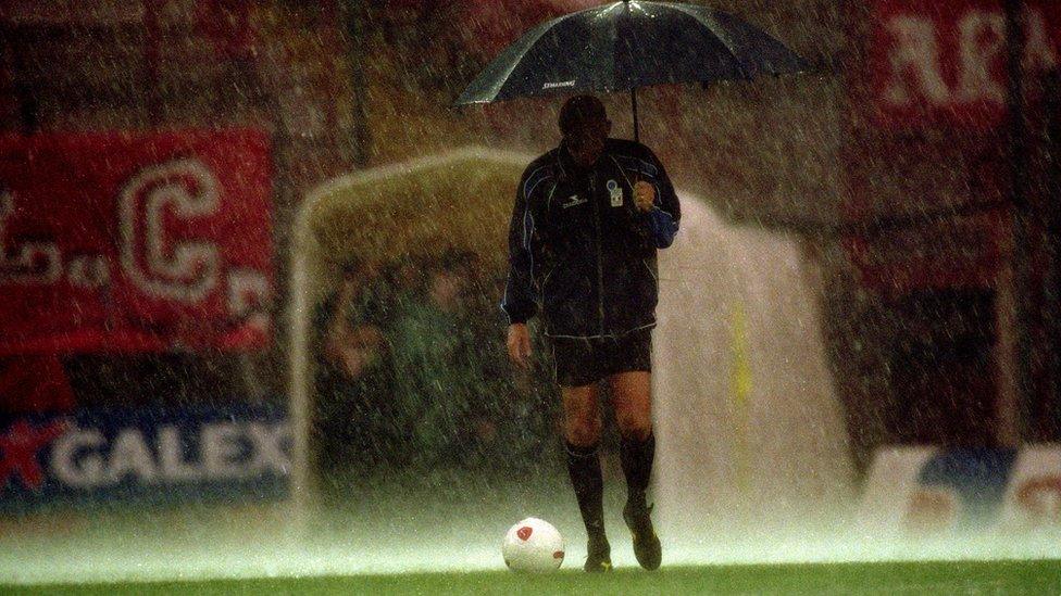 Pierluigi Collina with umbrella