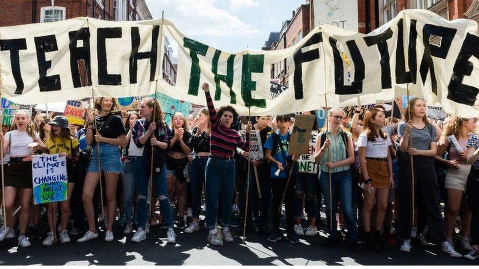 Teach the Future banner at climate demo