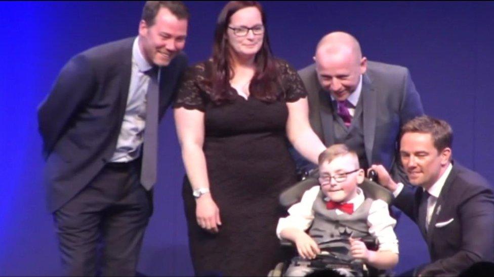 Oskar and his mother at awards ceremony