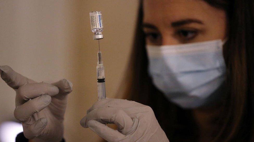 A pharmacist prepares doses of the Johnson and Johnson vaccine at a vaccination clinic in Boston, US on 4 March, 2021