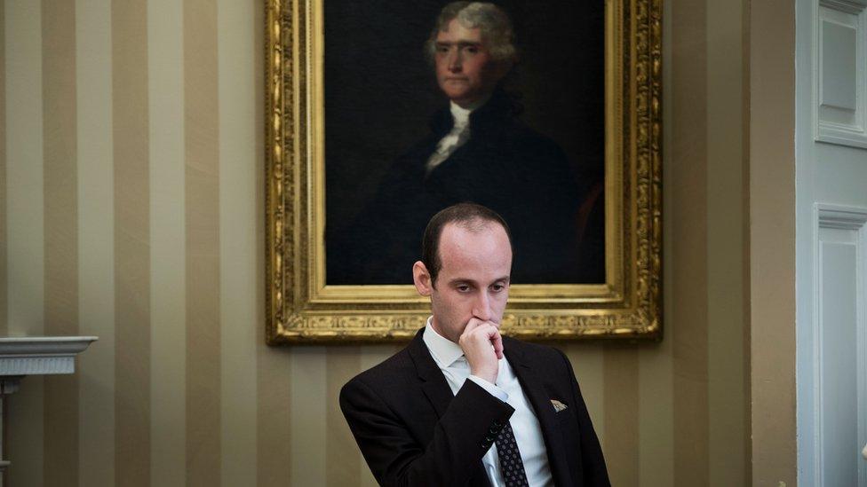 Stephen Miller sits and looks pensive