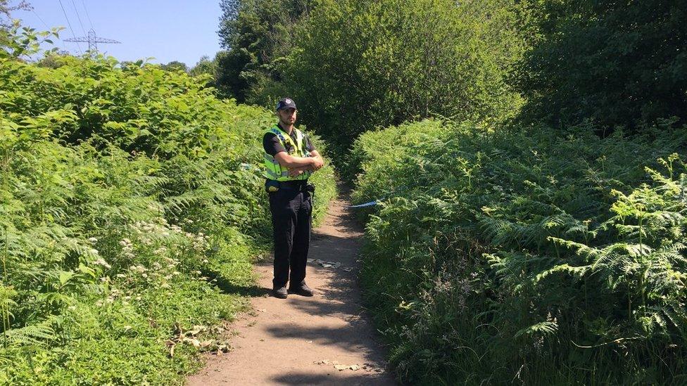 Police officer on path