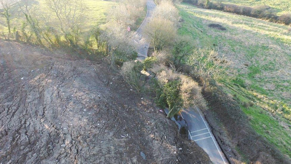 Drone image of landslip causing road to buckle