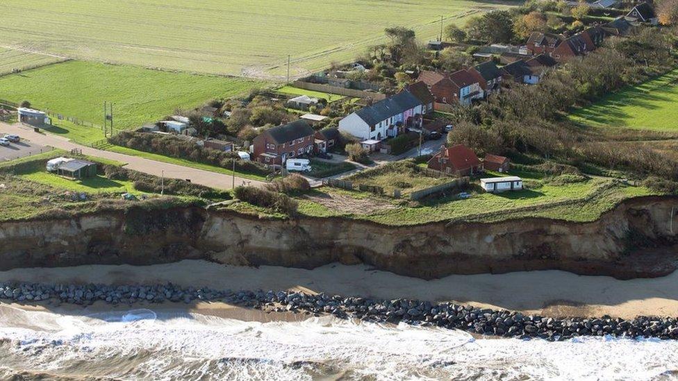 Ariel view of Homes perilously close to the cliff edge at Happisburgh, north Norfolk