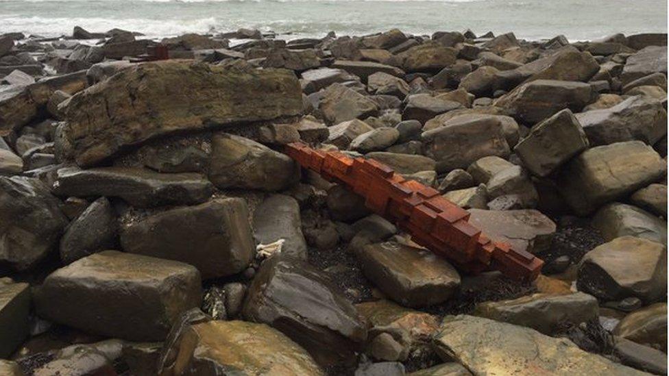 Toppled Gormley statue