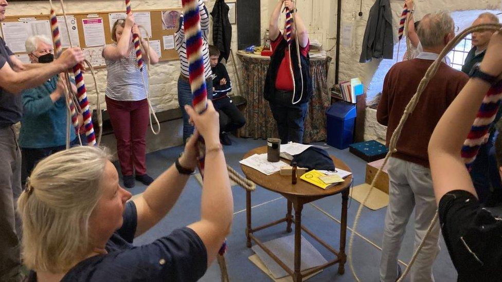 People ringing bells in a ringing chamber