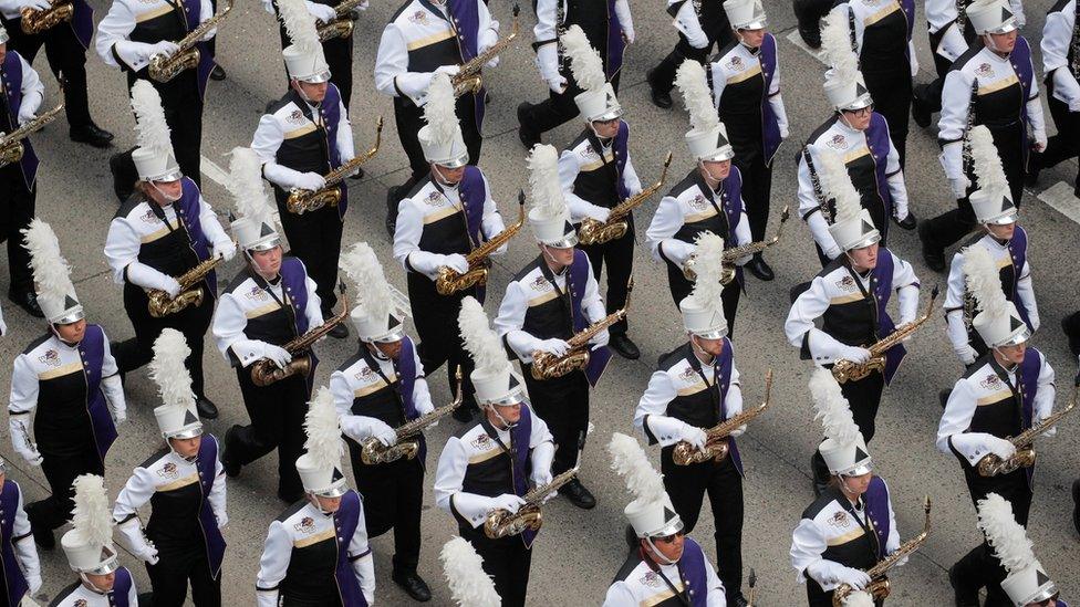 A marching band performing as part of the parade