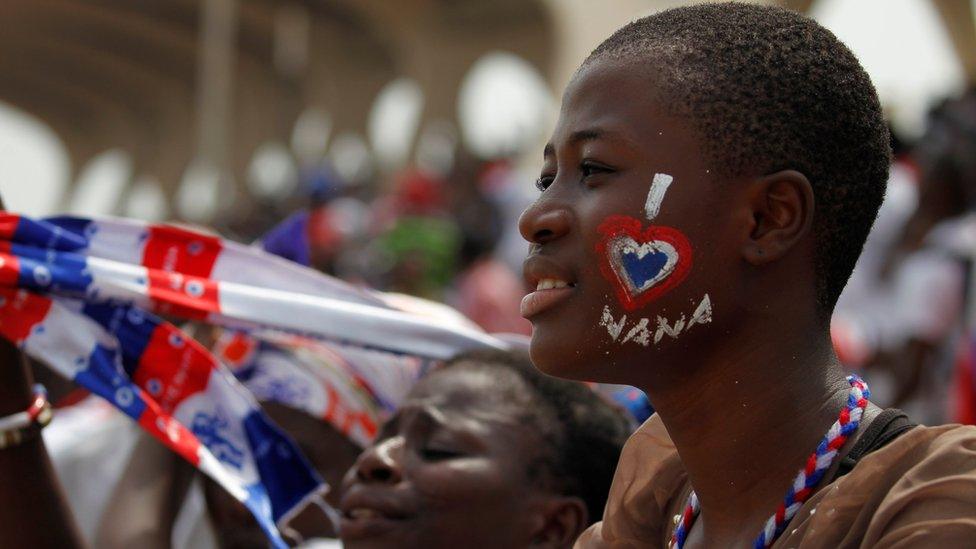 On Saturday, 7 Jan, a youngster "wears" on the cheek his support for Ghanaian new President Nana Akufo-Addo during his inauguration in Accra.