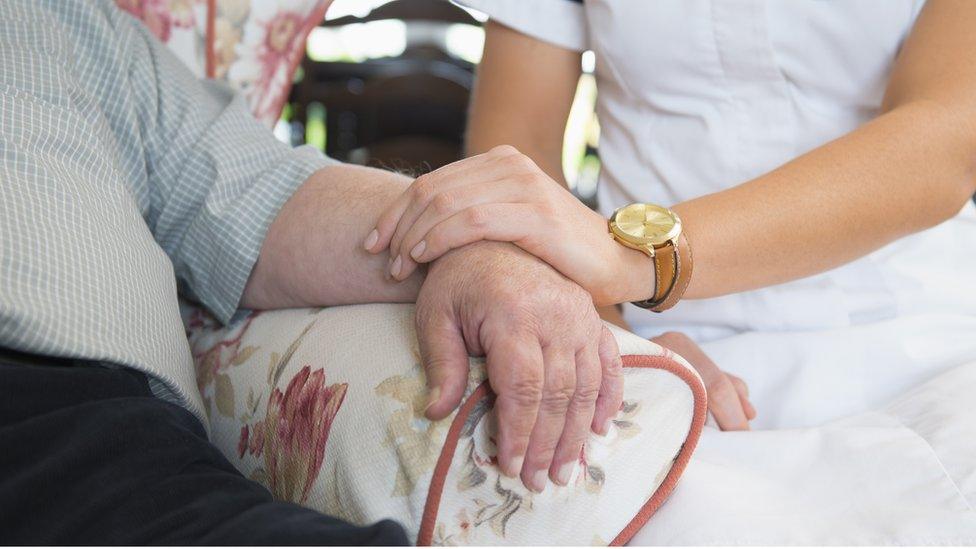 Carer with a patient