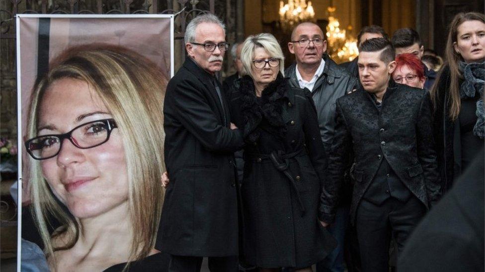 In this file photo taken on 8 November 2017 relatives of Alexia Daval, (from L) her father Jean-Pierre Fouillot, her mother Isabelle Fouillot, her husband Jonathan Daval, and her sister Stephanie walk past her portrait during at the basilica Notre Dame in Gray at the end of her funeral.