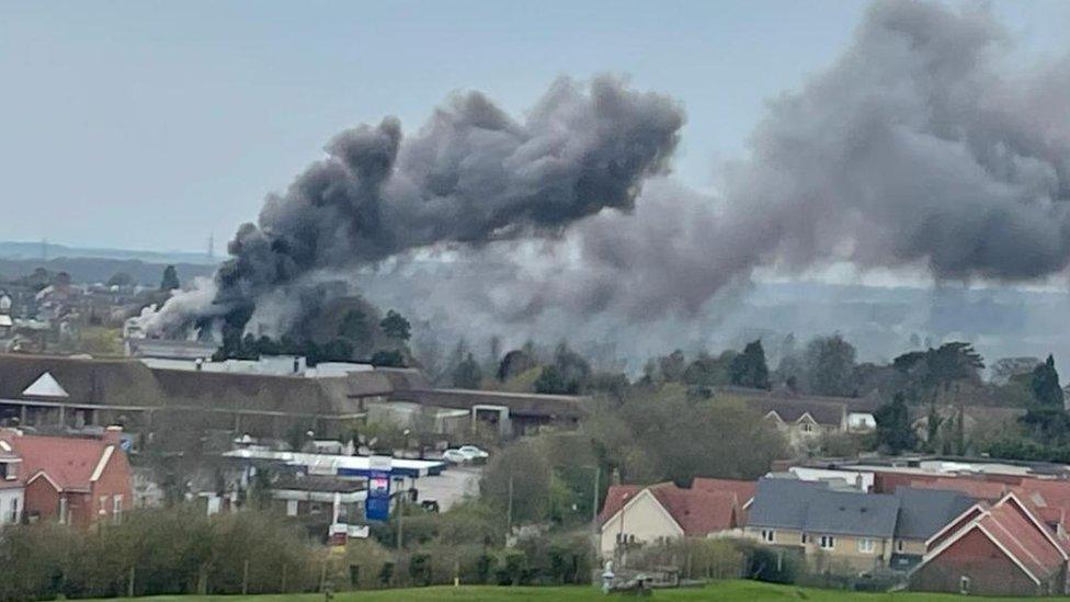 Smoke pouring out of a building