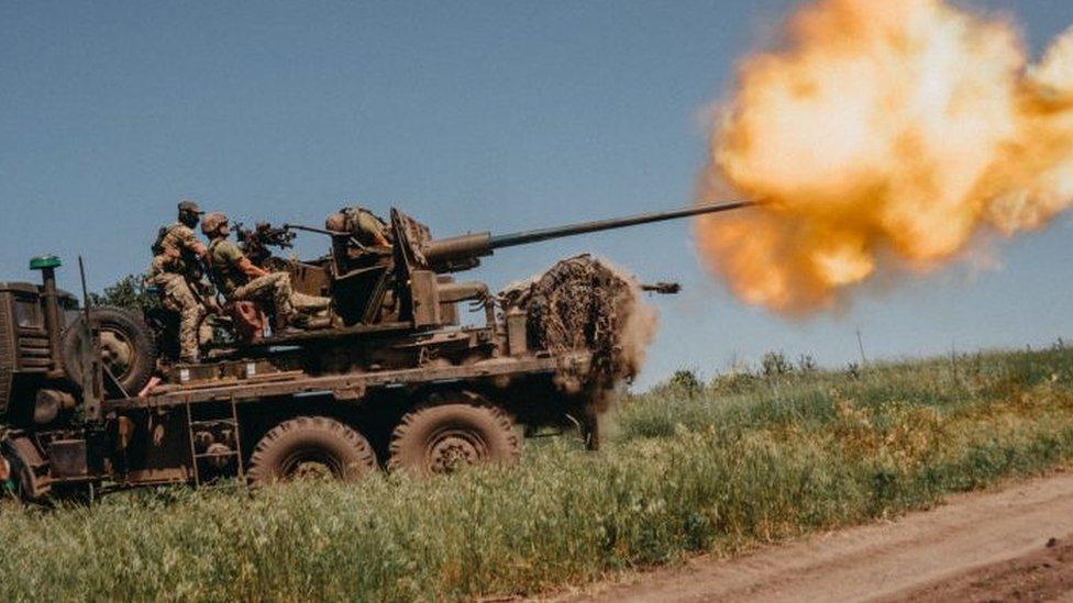 Ukrainian soldiers from the 60th Battalion of Territorial Defense, are shooting rounds into Russian positions with an S60 anti-aircraft canon placed on a truck, outside Bakhmut, Ukraine on June 19, 2023.